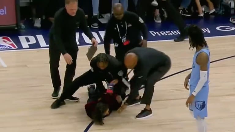 Protestors sitting behind Timberwolves owner Glen Taylor disrupt playoff game